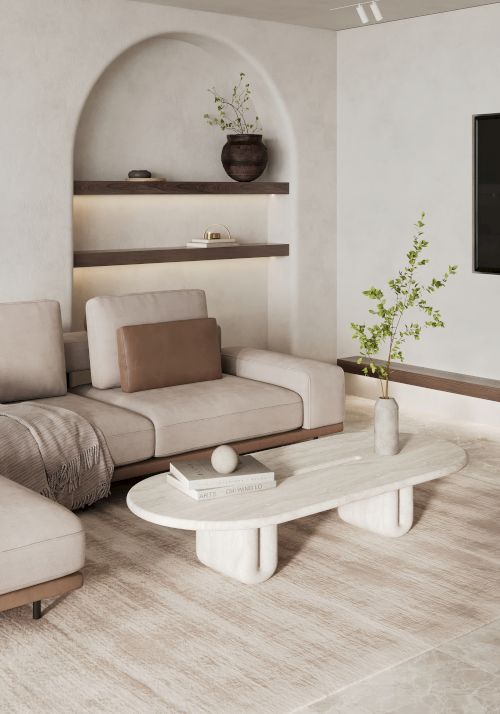 A modern living room features a sleek sectional sofa, a minimalist coffee table, wall-mounted shelves with decor items, and a plant beside the TV.